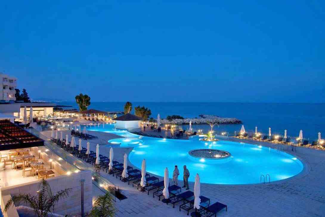 the royal apollonia pool by night