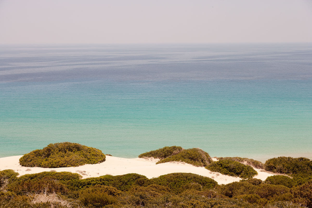 Where golden sands meet the turquoise sea...