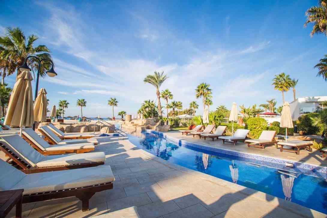 41 adams beach hotel pool sitting cyprus